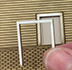 Textured lines across a rectangular image with a rectangle cut out in the middle.